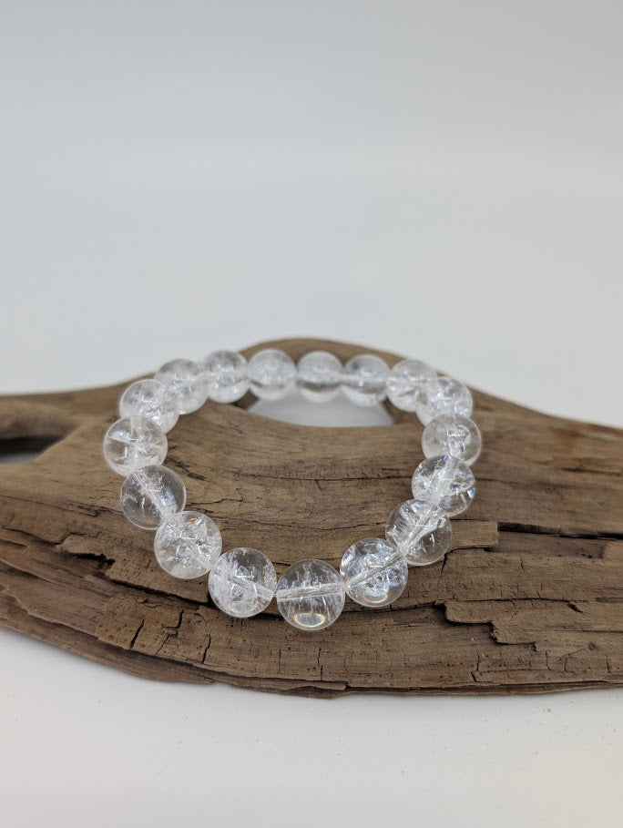 12mm Himalayan clear quartz bracelet with high polish and internal rainbows