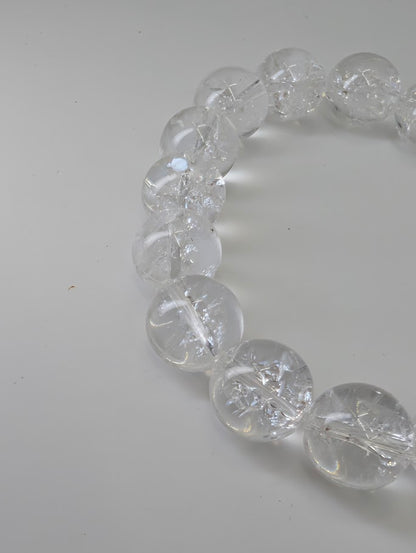 12mm Himalayan clear quartz bracelet with high polish and internal rainbows