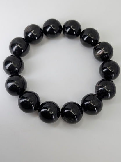15.5mm Hypersthene bracelet arranged in a circle showing metallic sheen and polished finish
