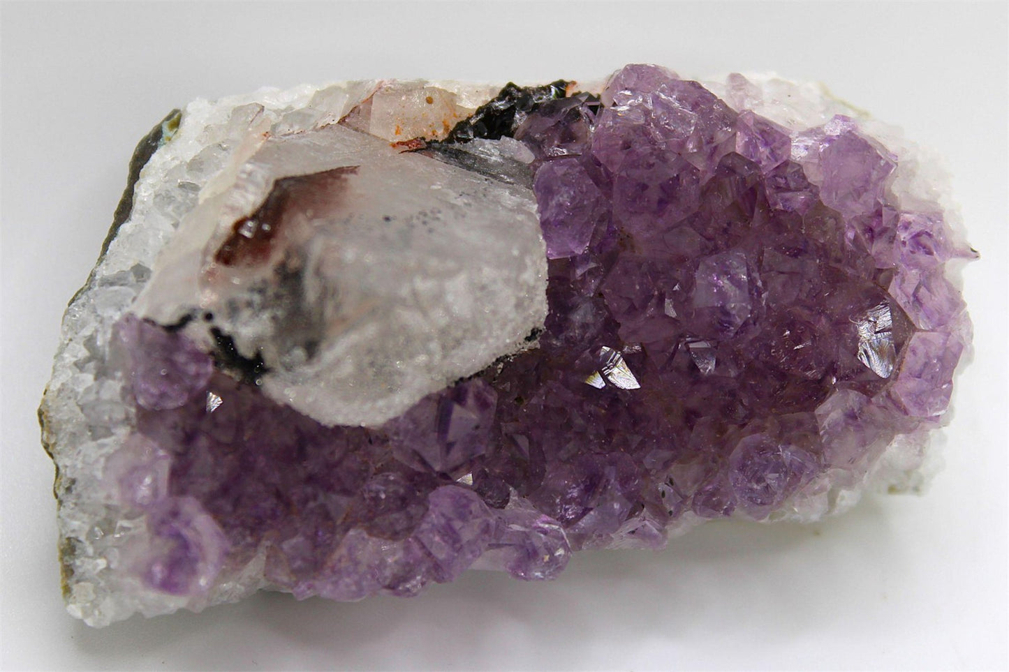 Amethyst Crystal Cluster with Sugar Calcite formation, from Brazil. Approx. 6 cm x 3.5 cm