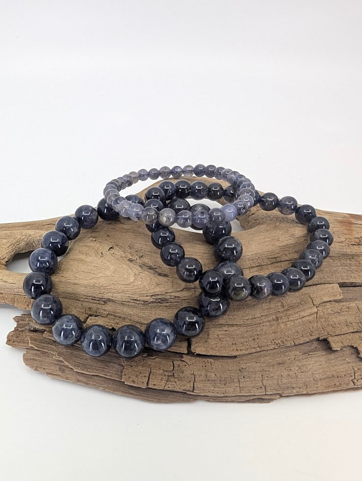 Iolite bracelets in 6 mm, 8 mm and 10mm showing deep blue-violet tone