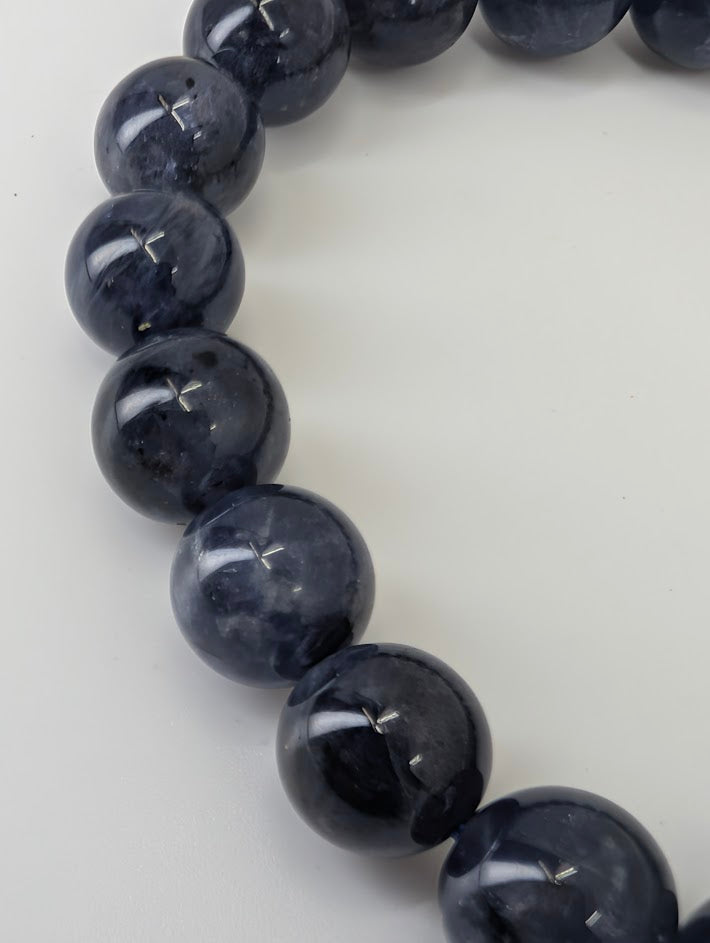 10 mm iolite bracelet with high polish and deep indigo color