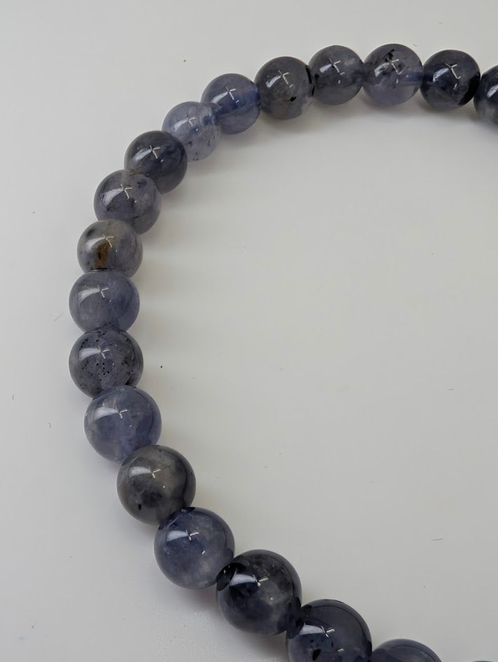 6 mm iolite bracelet showing uniform polish and subtle translucence