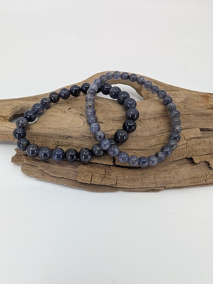 Iolite bracelets in 6 mm and 8 mm showing deep blue-violet tone