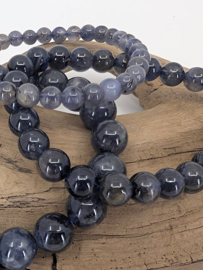 Close-up of iolite beads with pleochroic shimmer