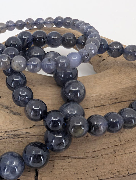 Close-up of iolite beads with pleochroic shimmer