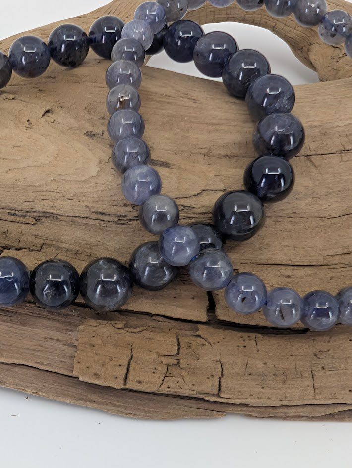Close-up of iolite beads with pleochroic shimmer