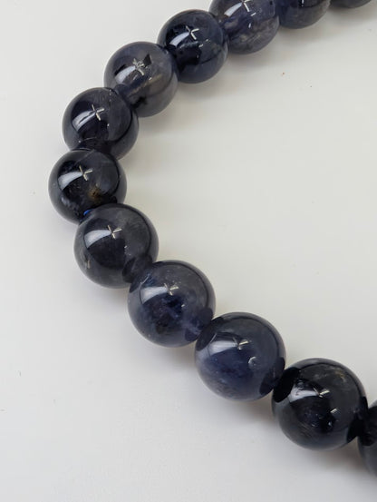 8 mm iolite bracelet with high polish and deep indigo color