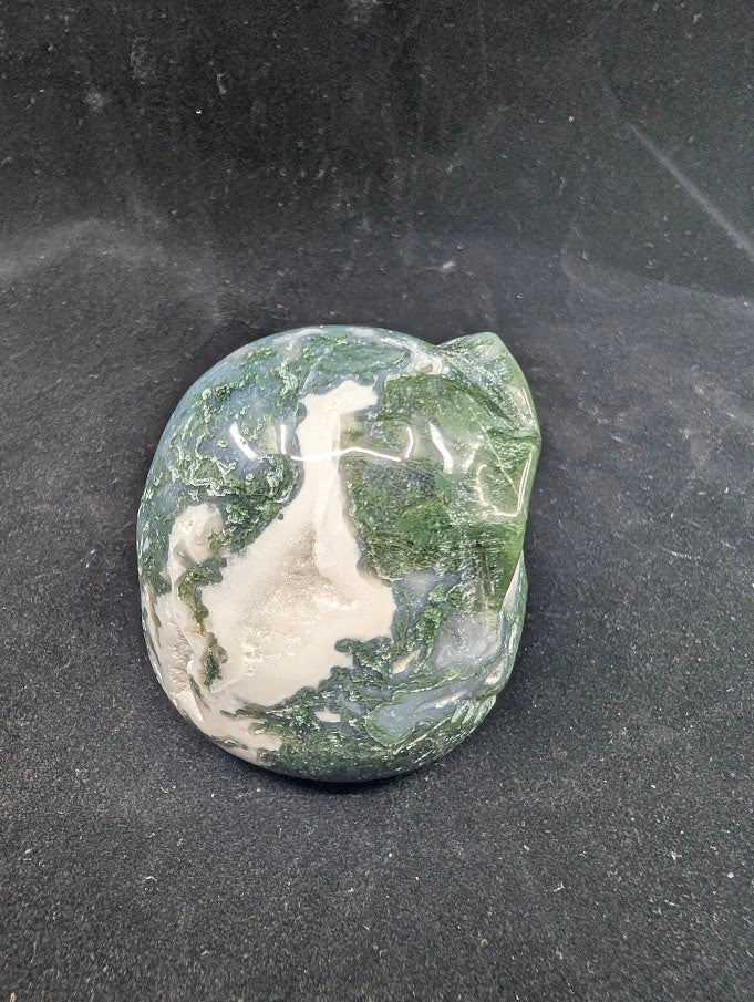 Back view of Moss Agate Jack Skellington carving showing green dendritic “moss” inclusions and glossy polish