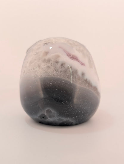 Detail of Ocean Agate Jack Skellington carving showing soft grey banding and glossy polish