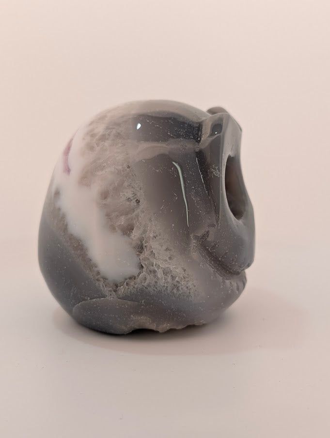 Detail of Ocean Agate Jack Skellington carving showing soft grey banding and glossy polish