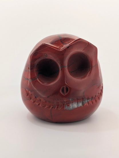 Detail of Red Jasper Jack Skellington carving showing rich red tones and natural veining