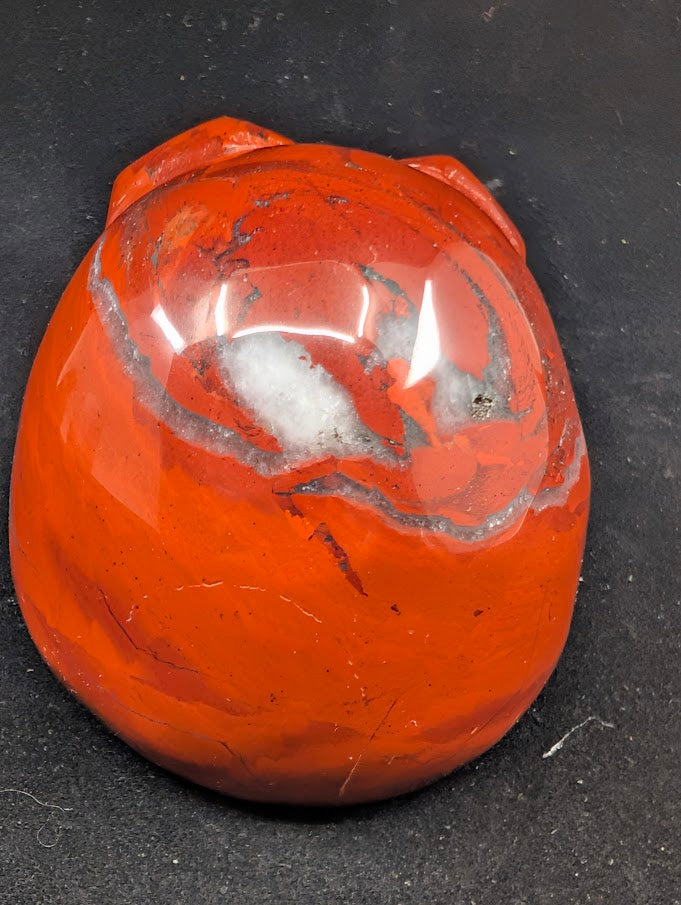 Detail of Red Jasper Jack Skellington carving showing rich red tones and natural veining of back 1
