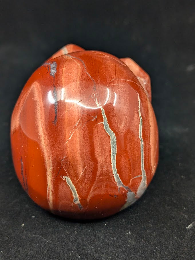 Detail of Red Jasper Jack Skellington carving showing rich red tones and natural veining of back 2