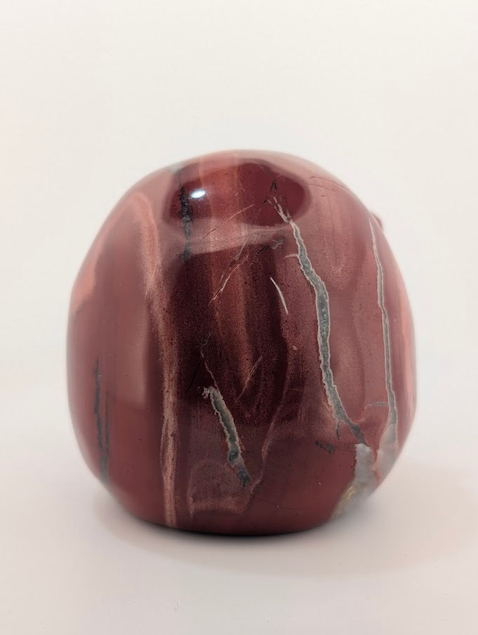 Detail of Red Jasper Jack Skellington carving showing rich red tones and natural veining of back 1