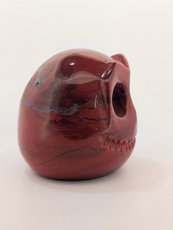 Detail of Red Jasper Jack Skellington carving showing rich red tones and natural veining of side 1