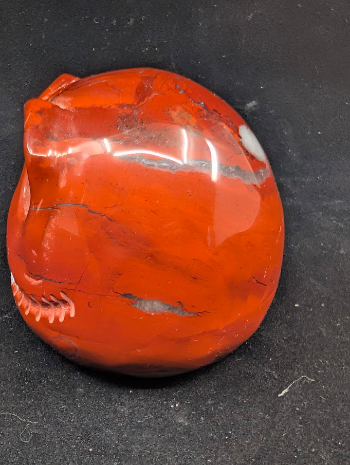 Detail of Red Jasper Jack Skellington carving showing rich red tones and natural veining of side 1
