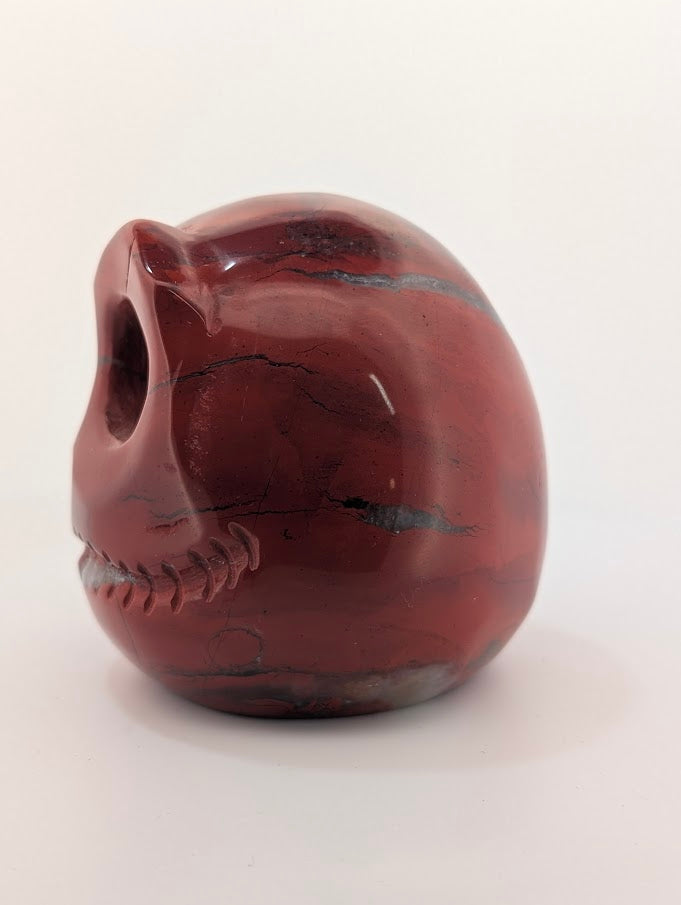 Detail of Red Jasper Jack Skellington carving showing rich red tones and natural veining of side 1