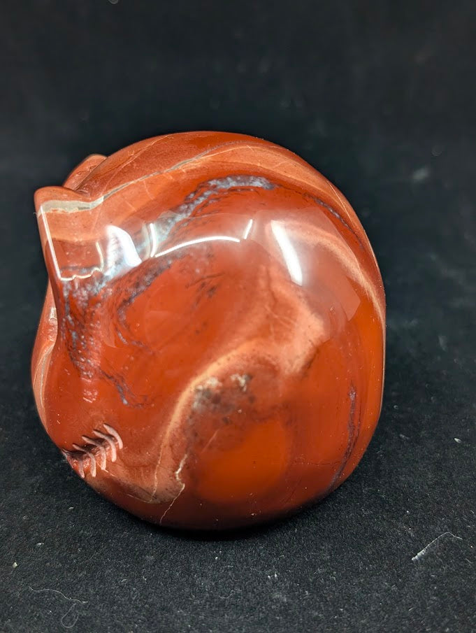 Detail of Red Jasper Jack Skellington carving showing rich red tones and natural veining of side 2