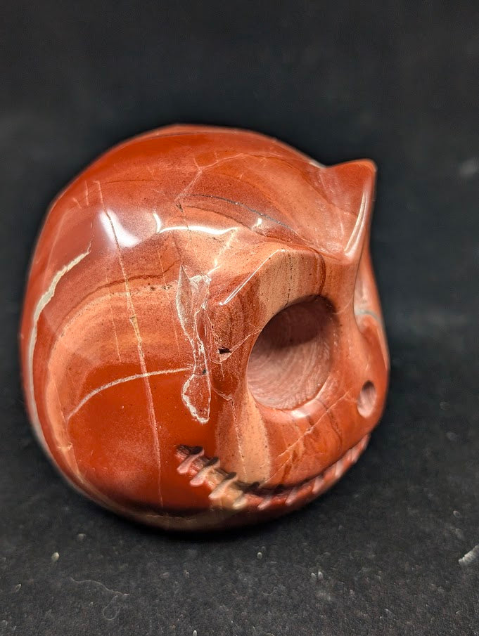 Detail of Red Jasper Jack Skellington carving showing rich red tones and natural veining of side 2
