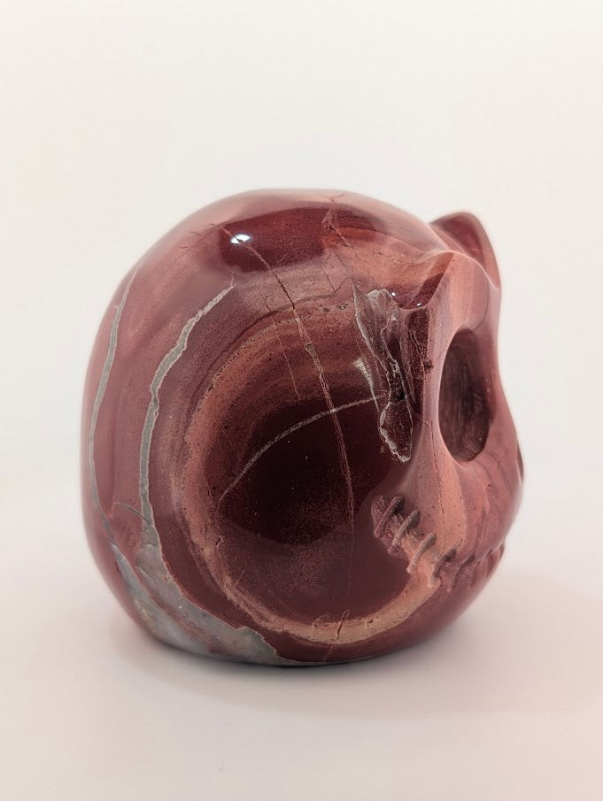 Detail of Red Jasper Jack Skellington carving showing rich red tones and natural veining of side 2
