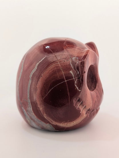 Detail of Red Jasper Jack Skellington carving showing rich red tones and natural veining of side 2