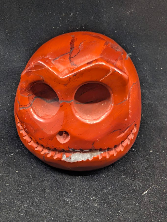 Detail of Red Jasper Jack Skellington carving showing rich red tones and natural veining of front 1