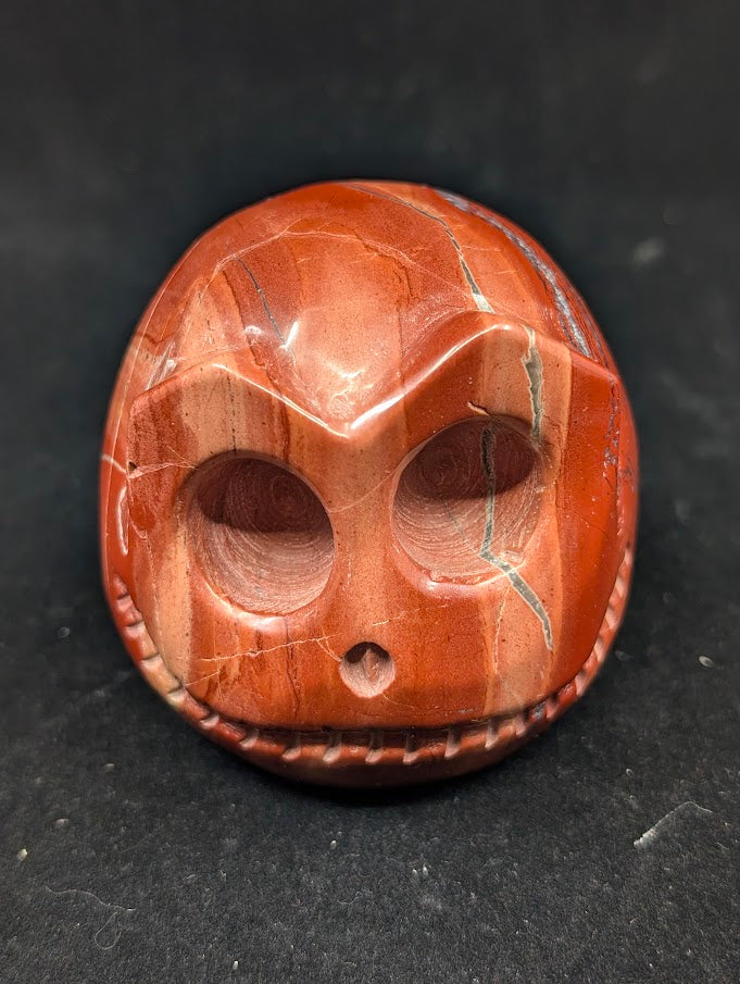 Detail of Red Jasper Jack Skellington carving showing rich red tones and natural veining of front 2