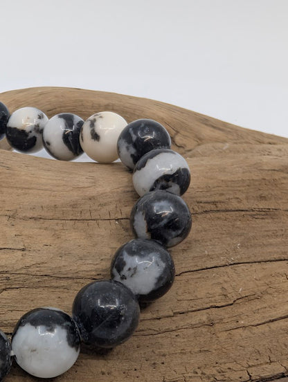 Macro of Zebra Jasper beads showing bold monochrome marbling