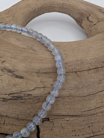 Close-up of labradorite bracelet showing blue labradorescence and clarity