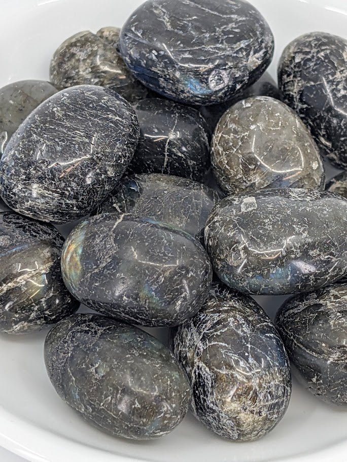 Close-up of Labradorite tumbled stones showing blue and gold flash