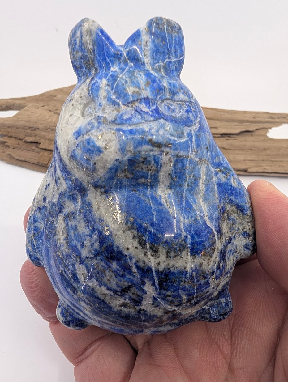 445g Lapis Lazuli Totoro held in hand highlighting the "starry night" pyrite inclusions.