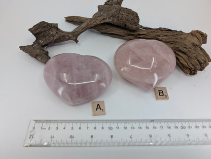 view of large Rose Quartz hearts A and B with size reference.