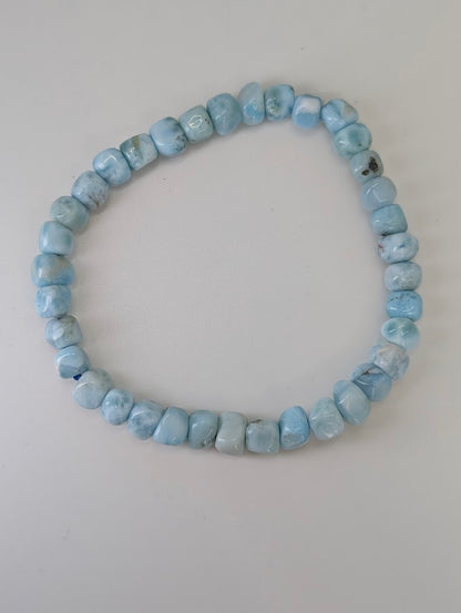 Natural Larimar bracelet with 5.5 mm nugget beads laid flat
