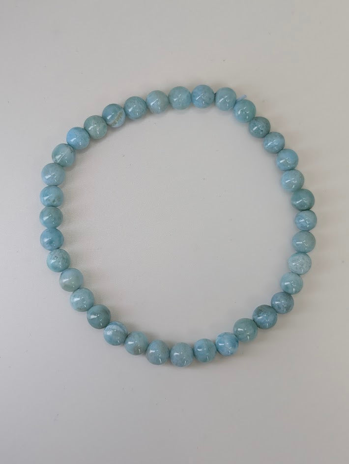 5 mm Larimar bracelet with polished round beads on white background