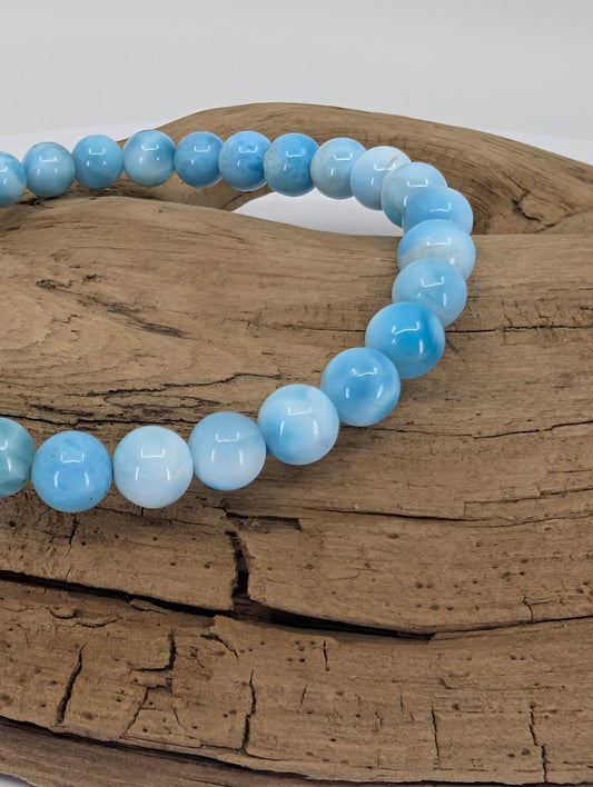 Closeup of Natural Larimar bracelet 6mm AA grade with soft blue marbling