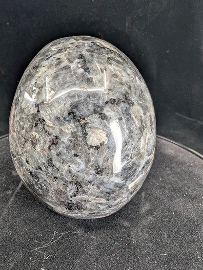 Back view of Larvikite skull with dark feldspar and natural inclusions