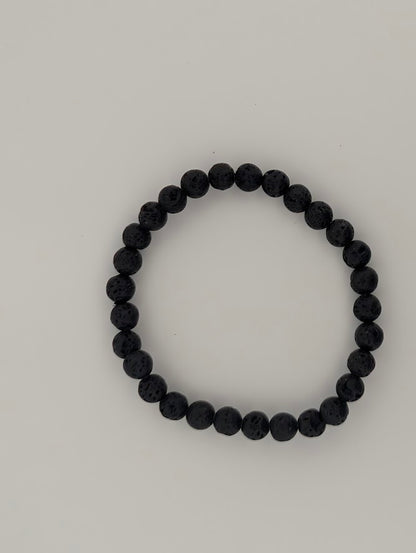 6mm lava stone bracelet laid flat in a circle on white background
