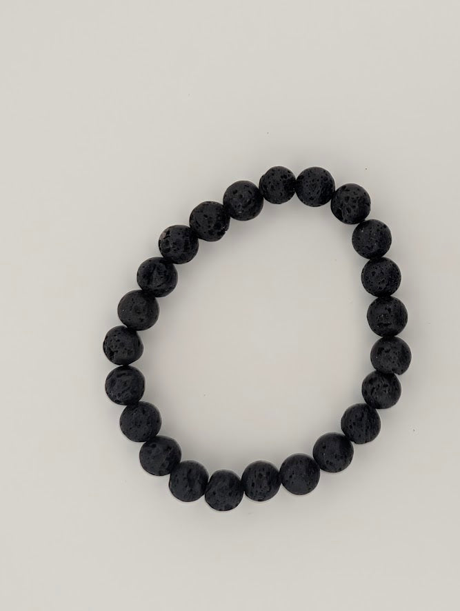 8mm lava stone bracelet laid flat in a circle on white background