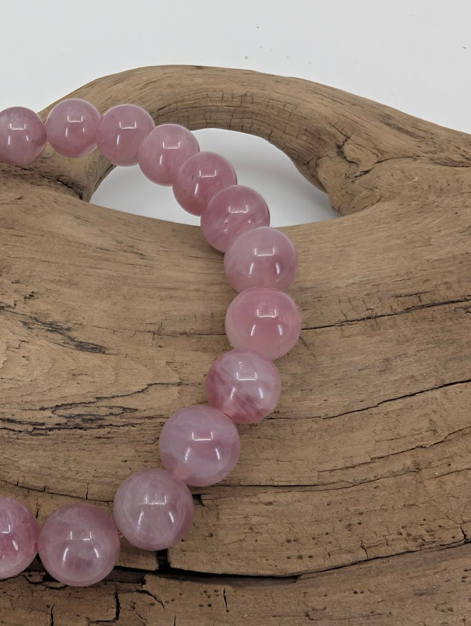 Close-up of Lavender Rose Quartz bracelet showing deep lavender color and clarity