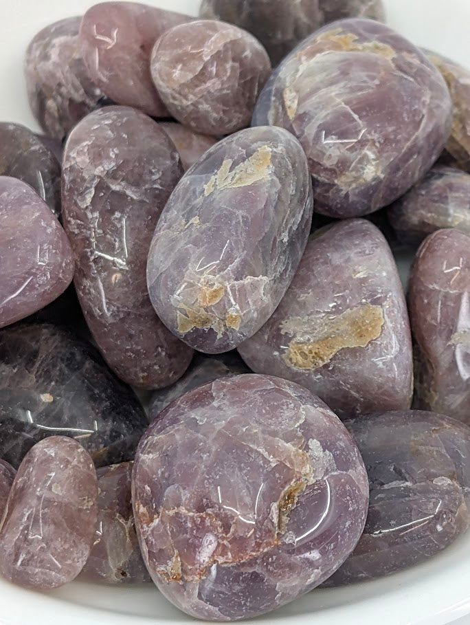 Close-up showing lavender-pink coloration and natural inclusions