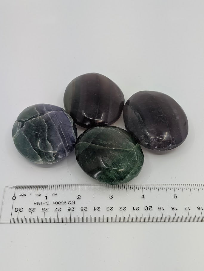 Top view of Fluorite Palm Stones showing translucency