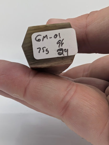 Base label of Goethite pseudomorph tower GM-01 showing 75 g weight and 9.6 × 2.4 cm dimensions