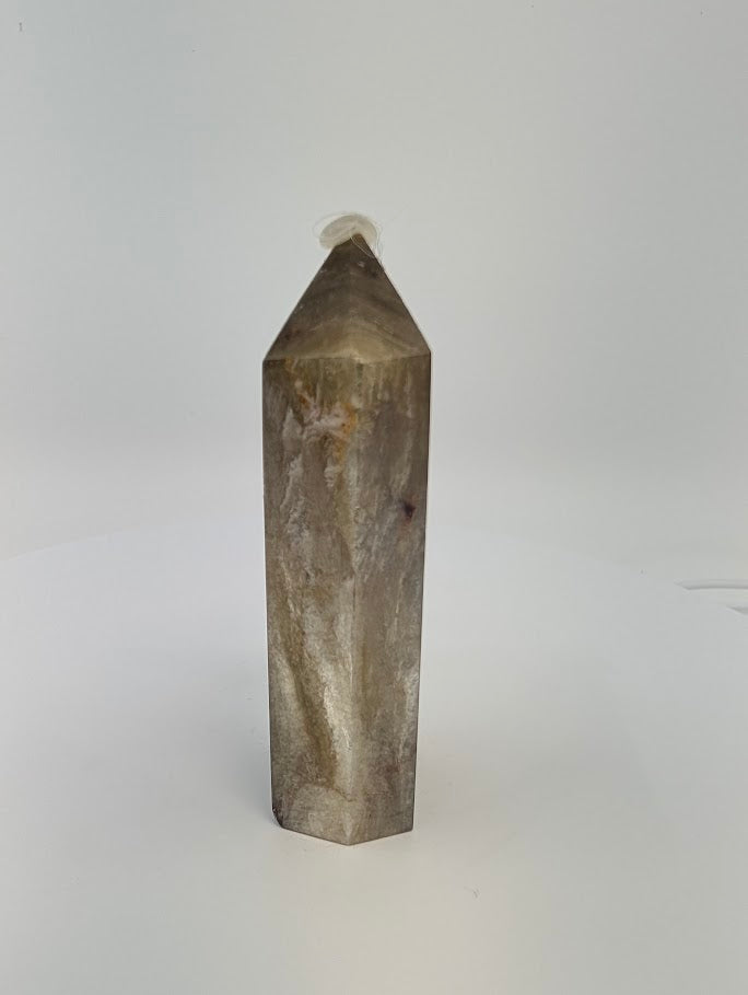 Angled front view of Golden Mica tower showing metallic transition from bronze to charcoal