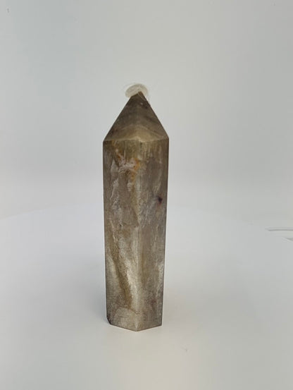 Angled front view of Golden Mica tower showing metallic transition from bronze to charcoal