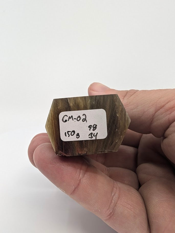 Base label of Golden Mica tower GM-02 showing 150 g weight and 9.8 × 3.4 cm dimensions