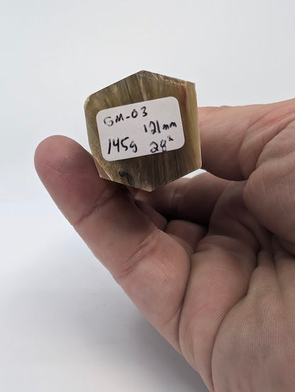Base label of Golden Mica tower GM-03 showing 145 g weight and 12.1 cm height