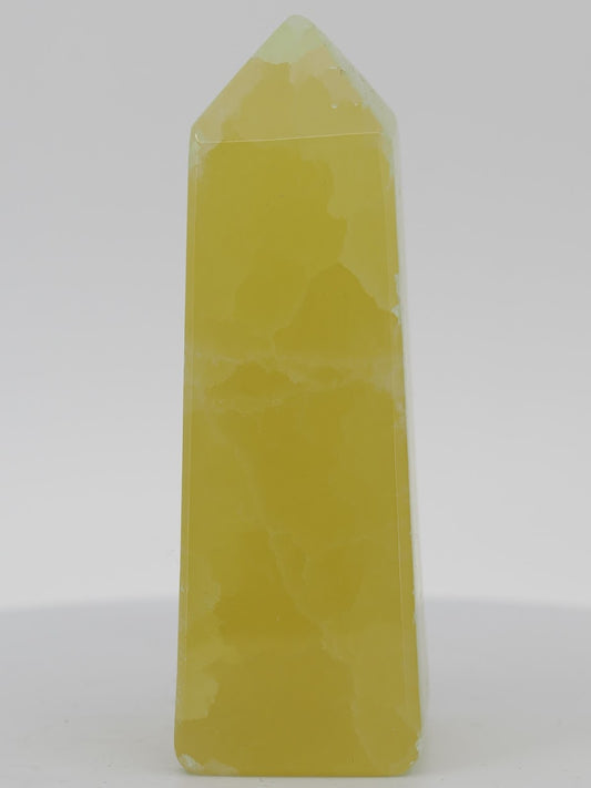 Polished Lemon Calcite tower from Pakistan featuring intense golden-yellow translucency and a high-gloss luster.