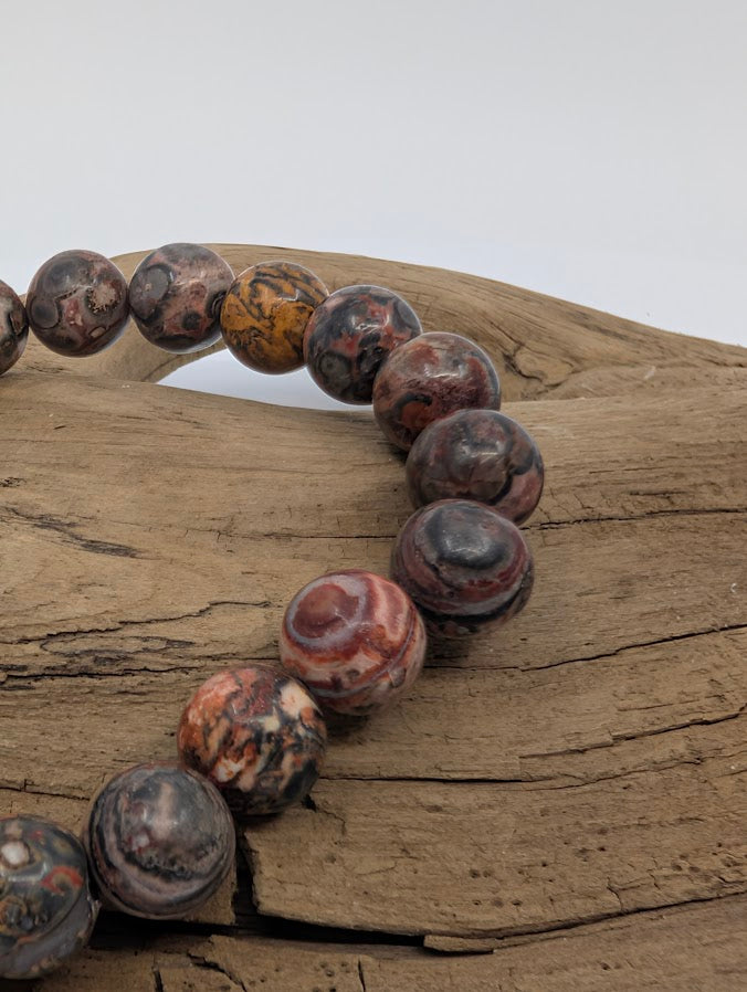 Close-up of leopard jasper beads showing bold rosettes and earthy tones