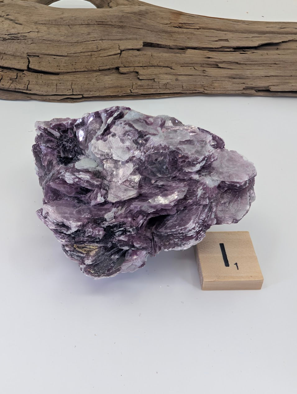 Premium AA-grade Lepidolite mica book with thick architectural layers and intense purple color.